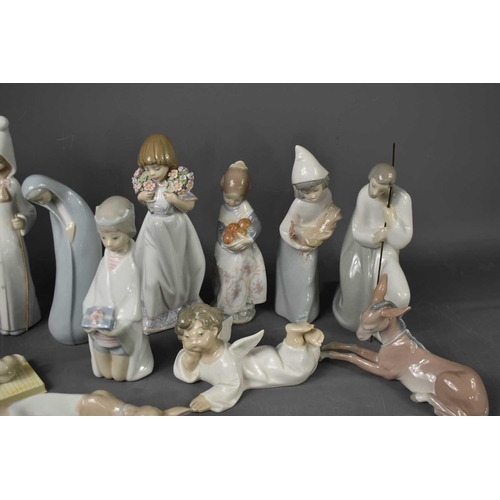 115 - A selection of Lladro figurines, to include angels, donkey, cow, shepherd, baby Jesus and other exam... 