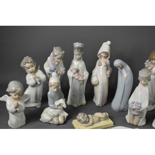 115 - A selection of Lladro figurines, to include angels, donkey, cow, shepherd, baby Jesus and other exam... 