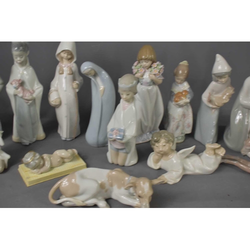 115 - A selection of Lladro figurines, to include angels, donkey, cow, shepherd, baby Jesus and other exam... 