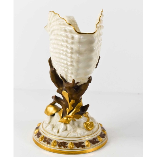 118 - A Royal Worcester nautilus shell spoon warmer, the ivory ground with gilded highlights and shells, w... 