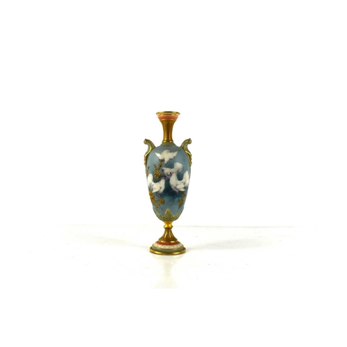 142 - Charles Baldwyn for Royal Worcester, a small baluster shaped pedestal vase with scroll handles, the ... 