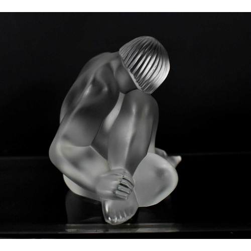 151 - A Lalique frosted glass paperweight figure 'Reve', in the form of a seated nude with one knee up, si... 