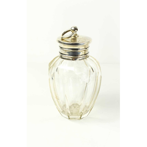 203 - A Dutch silver and cut glass scent bottle, the engraved cover having a hoop finial.