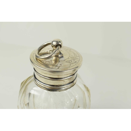 203 - A Dutch silver and cut glass scent bottle, the engraved cover having a hoop finial.