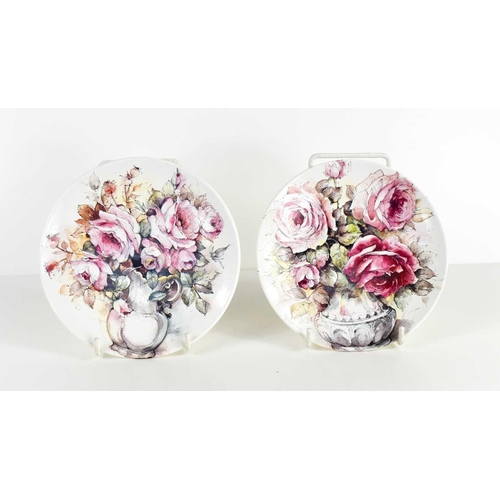 204 - A pair of Poole pottery dishes, painted to depict vases of pink and red roses, 'Romantic Bouquet', 1... 