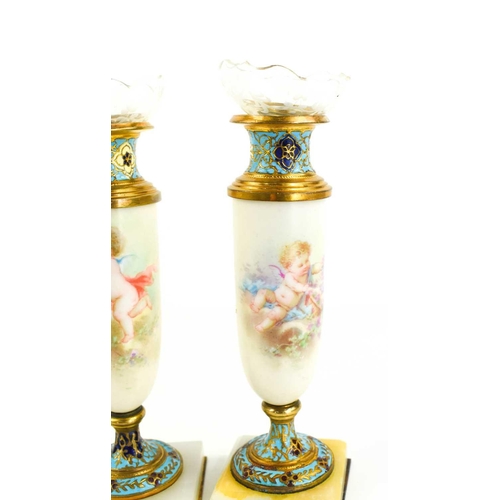 225 - A pair of fine porcelain and enamel vases, with decorative glass liners, the porcelain bodies painte... 