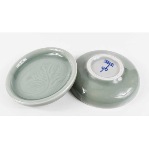 243 - A pair of Copenhagen celadon glazed pin dishes, 11½cm.