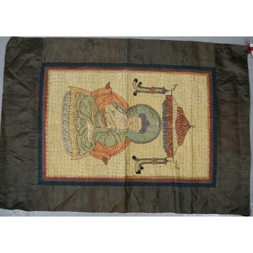 248 - A late 19th century Buddha beneath a canopy, floss silk with wrapped thread outline, silk lozenge pa... 