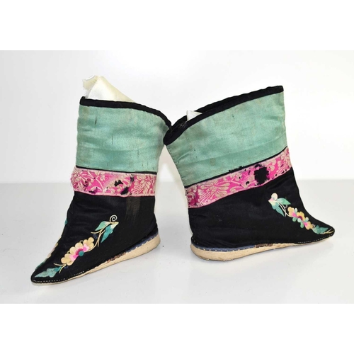 267 - A pair of Chinese lotus shoes with ankle wrappers, in green, pink and black silk, embroidered with f... 