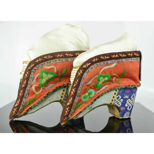 270 - A pair of Chinese bound feet shoes or 'lotus shoes', late Qing Dynasty, circa 1900, hand embroidered... 