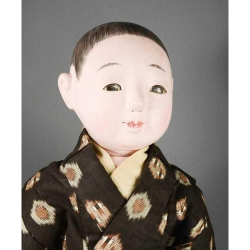 282 - An Itchimatsu doll, late Meiji period (1868-1910), wearing hakama and haori, 61cm long. [Ichimatsu d... 