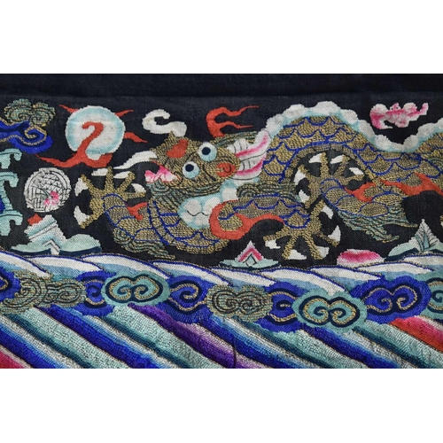 293 - A Chinese late Qing dynasty Kossu embroidered panel, circa 1910, depicting a dragon with four rounde... 