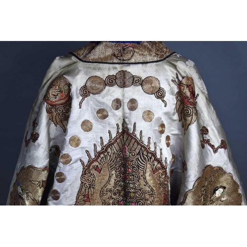 295 - A late Qing dynasty Chinese Daoist silk robe with lilac damask ground, elaborately decorated with go... 