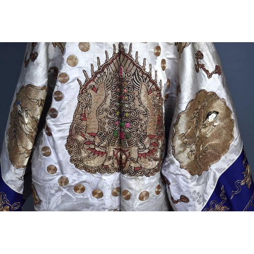 295 - A late Qing dynasty Chinese Daoist silk robe with lilac damask ground, elaborately decorated with go... 