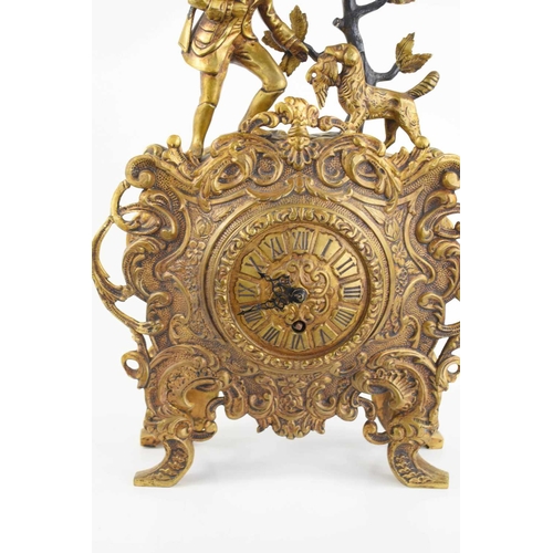 299 - A 19th century gilt brass mantle clock, the decoratively cast body surmounted by a huntsman with his... 