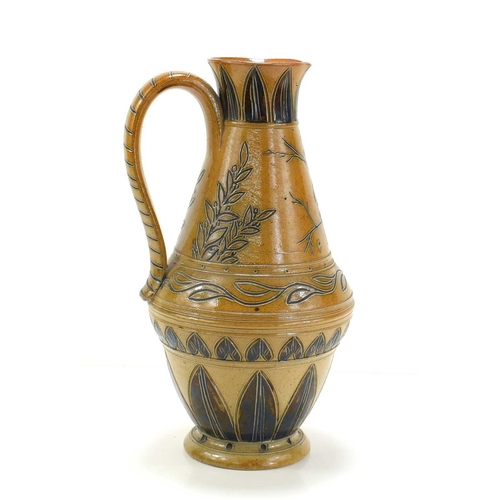 32 - Hannah Barlow for Doulton Lambeth: A salt glazed stoneware jug, the body decorated with a bird among... 