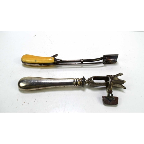 321 - An antique Stilton scoop with a bone handle, along with a metal leg of lamb holder.