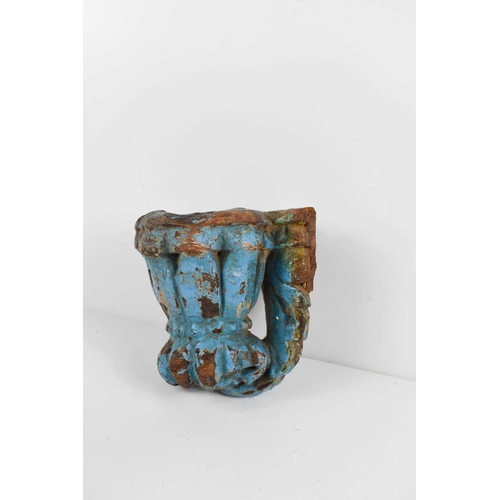 327 - An antique blue painted wall sconce / pricket, of lobed form, 11cm high.