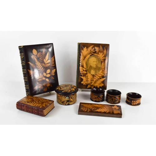 336 - A collection of Mauchline Fernware, to include three napkin rings, a cotton reel box, Wordsworth and... 