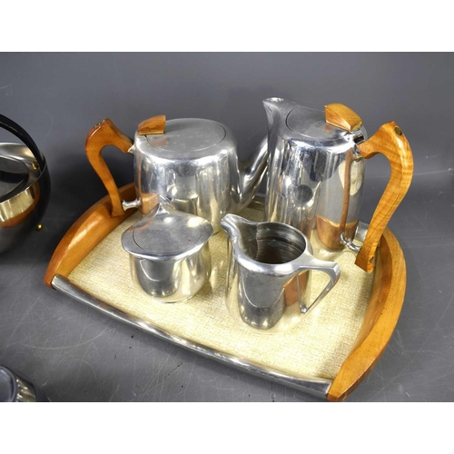 354 - A group of vintage kitchenware to include a four-piece Picquot Ware tea and coffee service, a three-... 