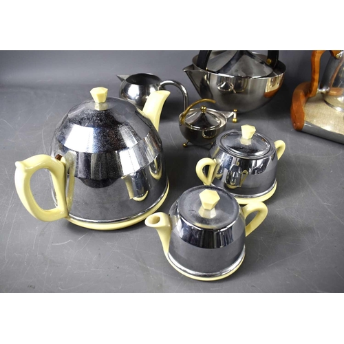 354 - A group of vintage kitchenware to include a four-piece Picquot Ware tea and coffee service, a three-... 