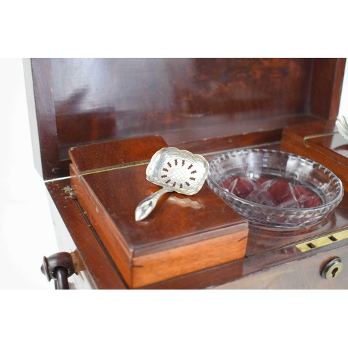 365 - A 19th century mahogany sarcophagus form tea caddy, with the original interior boxes, glass bowl and... 