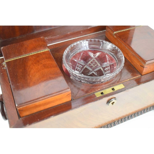 365 - A 19th century mahogany sarcophagus form tea caddy, with the original interior boxes, glass bowl and... 