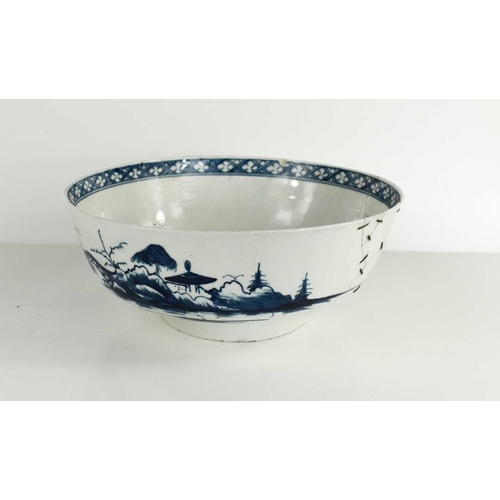 39 - An 18th century Worcester blue and white bowl, depicting a Chinese landscape, repaired with rivets, ... 