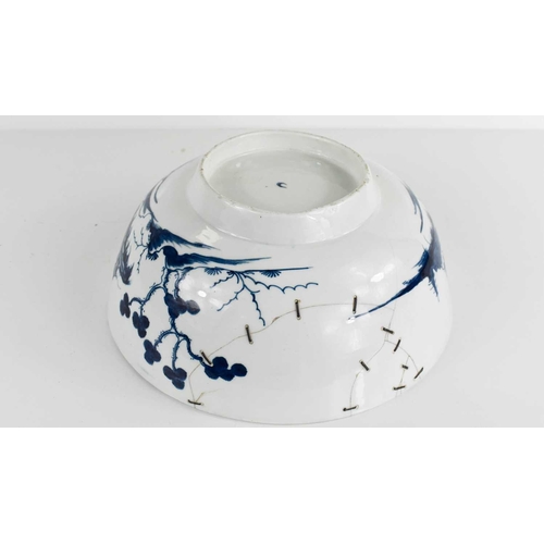 39 - An 18th century Worcester blue and white bowl, depicting a Chinese landscape, repaired with rivets, ... 