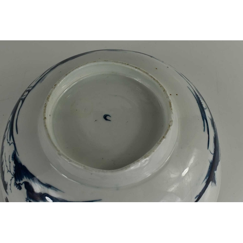 39 - An 18th century Worcester blue and white bowl, depicting a Chinese landscape, repaired with rivets, ... 