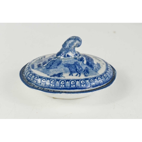 40 - A 19th century blue and white lozenge form dish depicting a lion, together with a miniature tureen d... 