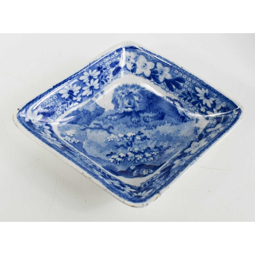 40 - A 19th century blue and white lozenge form dish depicting a lion, together with a miniature tureen d... 