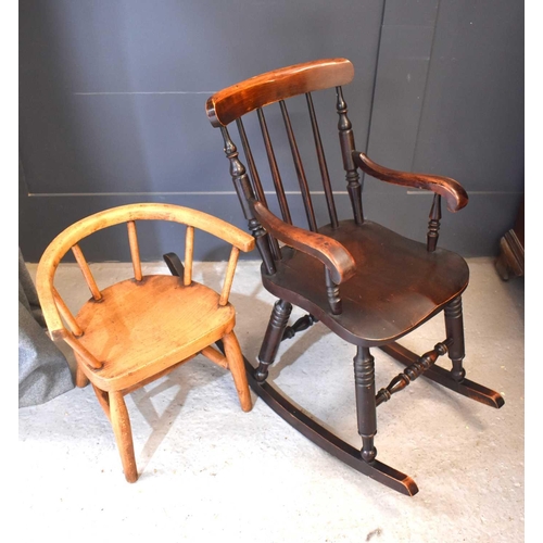 492 - A Victorian mahogany children's rocking chair together with an oak spindle back child's armchair.