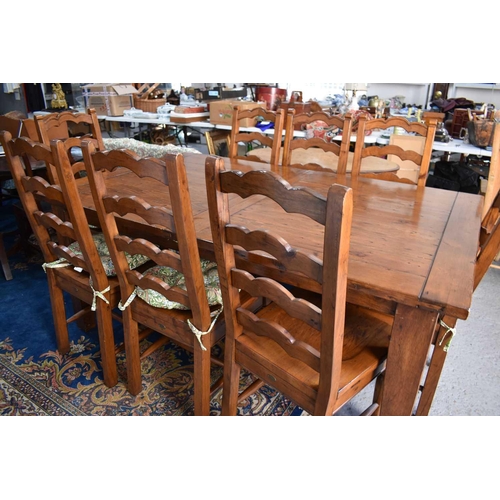 497 - The Irish Coast Collection extendable dining table and matching set of eight chairs.