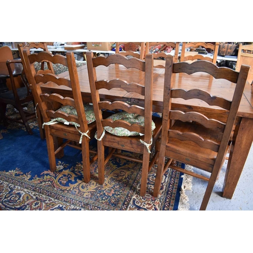 497 - The Irish Coast Collection extendable dining table and matching set of eight chairs.