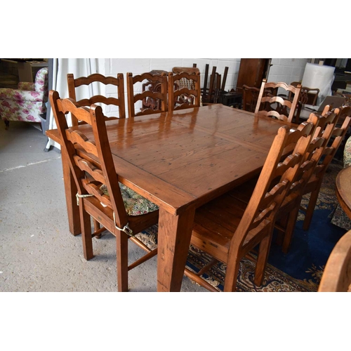 497 - The Irish Coast Collection extendable dining table and matching set of eight chairs.