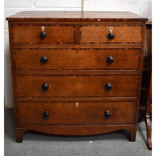 498 - A 19th century oak chest of drawers with two over three long graduated drawers, raised on bracket fe... 