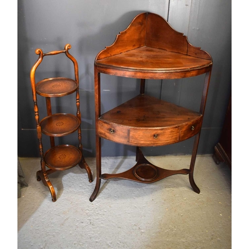 500 - A 19th century mahogany washstand with shaped back, mid tier shelf, together with a mahogany cake st... 