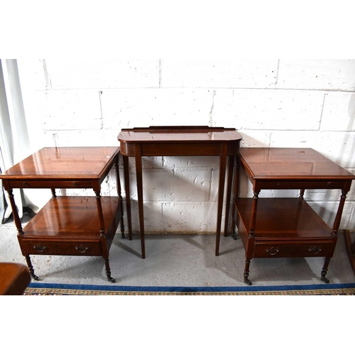 501 - A pair of mahogany bedside tables with leather top slides, single drawer below and raised on castors... 