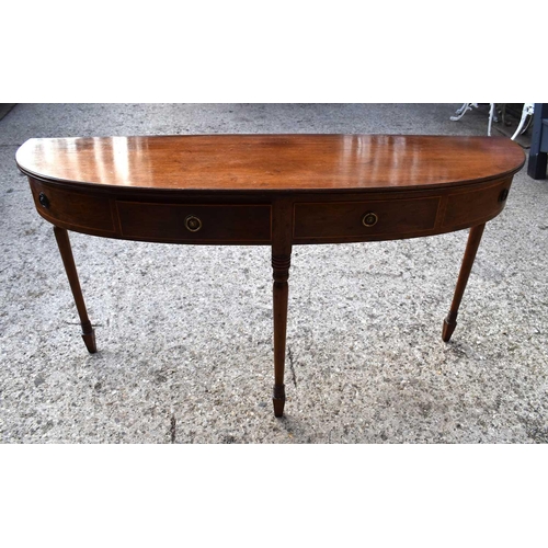 503 - A Regency mahogany side table of demi-lune form with two drawers flanked by dummy drawers raised on ... 