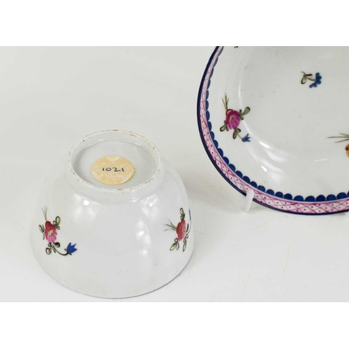 52 - A 19th century teapot, tea bowl and saucer, likely New Hall, painted with pink and blue borders, and... 