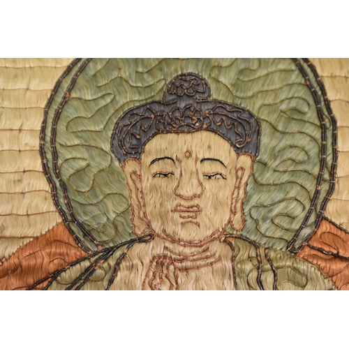 248 - A late 19th century Buddha beneath a canopy, floss silk with wrapped thread outline, silk lozenge pa... 