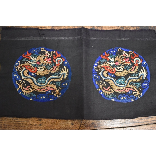 273 - A collection of 19th century and later Chinese silk fabrics to include roundels from a Chao Fu forma... 