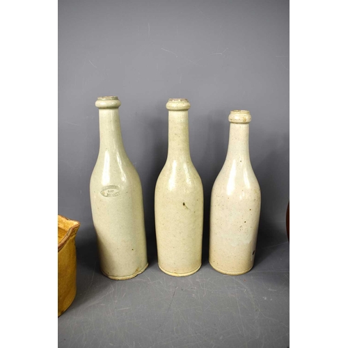 117 - A quantity of antique stoneware items to include three grey bottles, one stamped 