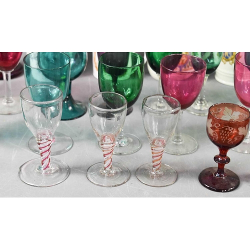 130 - A selection of 19th century and later glassware, including three spiral twist glasses, a pair of red... 