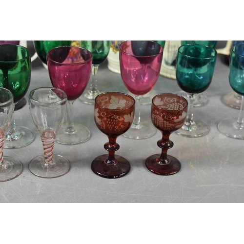 130 - A selection of 19th century and later glassware, including three spiral twist glasses, a pair of red... 