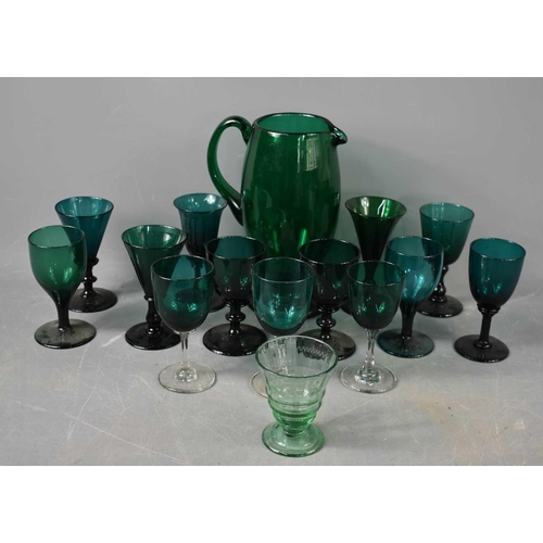 131 - A selection of mid 20th century green glassware, to include jug, and glasses of various form.