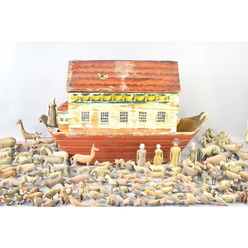 16 - A large Erzgebirge German Noah's ark and animals, mid 19th century, the pine arc painted with window... 