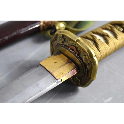 19 - A WWII period Japanese officers Shin Gunto sword with rayskin tsuka wrapped with cord binding, gilt ... 