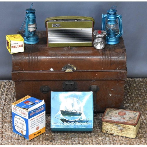 29 - A vintage metal steamer trunk together with a pair of Boots binoculars, Roberts Radio, battery opera... 